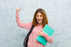 young student woman shouting triumphantly looking like excited happy surprised winner celebrating against grunge wall background 1194 32325 300x200 - انجام پرسشنامه | ساخت پرسشنامه | انجام پرسشنامه پایان نامه